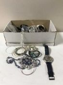 A quantity of lady's costume jewellery including wristwatches, bangles etc,