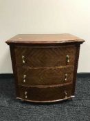 A mahogany bow-fronted three drawer chest