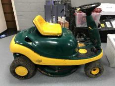 A Yard Man petrol ride on lawn mower with key