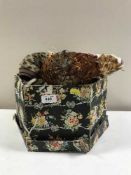 A box of vintage lady's hats including a feather hat