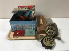 A tray containing horse brasses, Beatles 45, cribbage board,