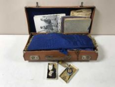 A leather case of Freemason's regalia, books,