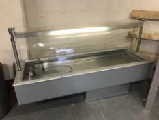 A refrigerated display cabinet with white granite counter