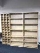 Two sets of contemporary open shelves and three matching CD racks