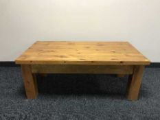 A rectangular pine coffee table