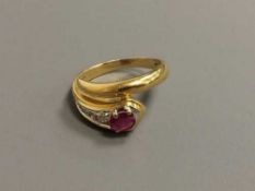 An 18ct gold ruby and diamond snake ring, 4.