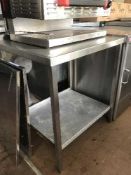 A stainless steel two tier prep table