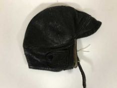 A vintage brown leather motorcycle cap