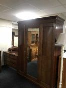 A three piece mahogany bedroom suite