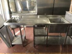 A stainless steel double sink with drainer