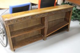 A set of heavily carved oak open bookshelves CONDITION REPORT: Some watermarks and