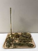 A tray of brass gavel, horse bit, fire poker on stand, brass teapot stands,