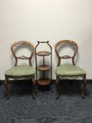 A pair of Victorian balloon back chairs and a folding cake stand