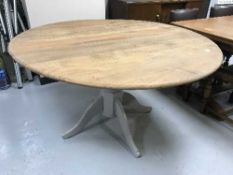 A pine pedestal table with an Ercol top