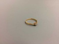 An 18ct gold diamond solitaire ring, 0.