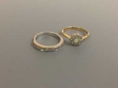 A white gold diamond half eternity ring and an 18ct gold diamond and opal cluster ring