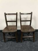 A pair of oak child's chairs