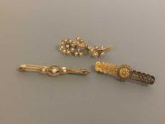 Three 15ct gold brooches, two set with pearls, 8.