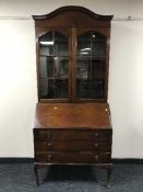 A mahogany bureau bookcase on cabriole legs