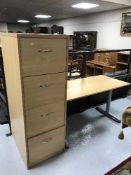 A beech four drawer filing chest and an office table
