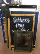 A quantity of restaurant signs, pin board,