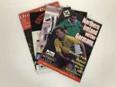 A box of international and non league football programmes