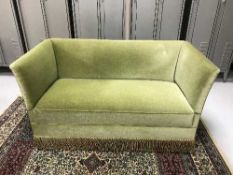 A three piece green dralon lounge suite