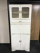 A painted mid 20th century kitchen cabinet