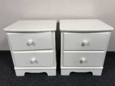 A pair of cream two drawer bedside chests
