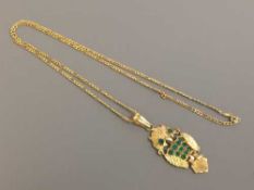 18 ct owl pendant set with emerald and chain. 12.