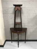 An inlaid mahogany d-shaped table and a plant stand