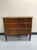A mahogany three drawer chest with brass drop handles