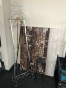 A folding metal easel, plant stand,