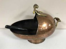 A copper coal receiver with shovel