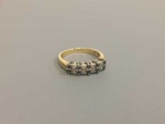 An 18ct gold sapphire and diamond ring