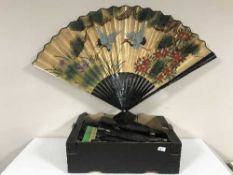 A box of leather briefcase, hand painted fan, child's mannequin,