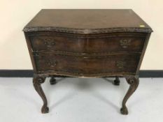A walnut serpentine fronted two drawer chest