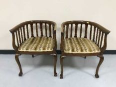 A pair of mahogany rail back tub chairs on claw and ball feet