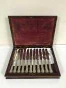 A mahogany canteen of plated knives and forks