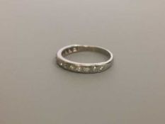 An 18ct white gold diamond half eternity ring, approximately 0.75ct.
