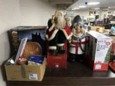 A boxed Halloween pumpkin, assorted Christmas decorations and lights, bust of Santa,