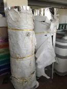 Two large rolls of stainless steel sheeting