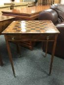 An early 19th century inlaid walnut games table