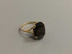 A 9ct gold smoky quartz ring