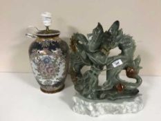 A large soapstone carving of a dragon,