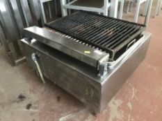 A stainless steel griddle and two stainless steel shelves