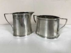 A silver sugar pot and milk jug, 8.