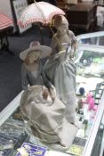 A Lladro figure group - girl seated with puppy CONDITION REPORT: Appears to be in