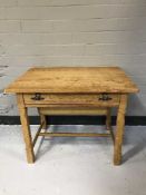 A blonde oak sewing table fitted a drawer