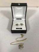 A 9ct gold pendant on chain with matching earrings